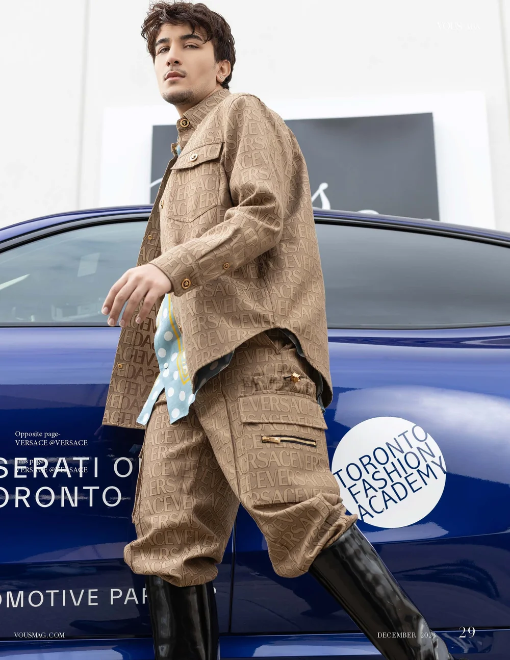 Versace editorial styling featured in a fashion publication beside a blue car.