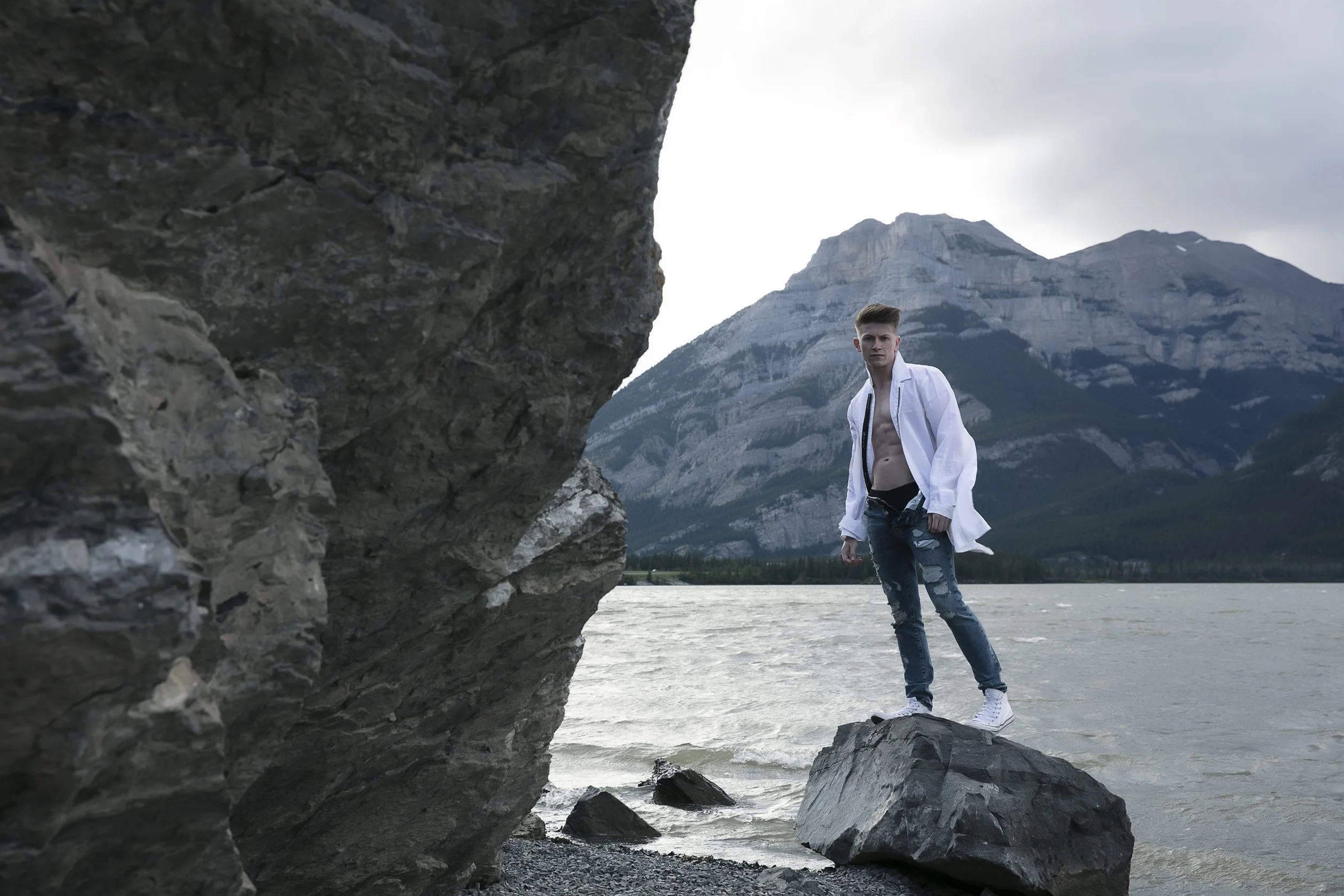 Benjamin Wills in a sculptural outdoor fashion portrait at the lake.