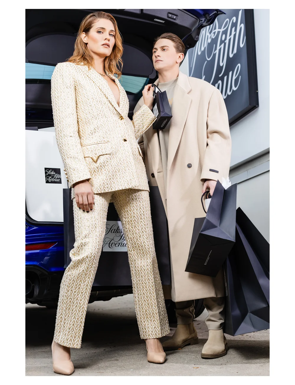 Editorial portrait of Benjamin Wills styling a model in a luxury campaign.